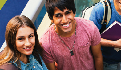 Two students smiling